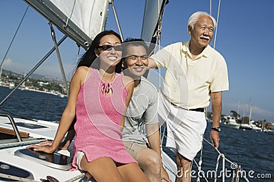 Family on sailboat Stock Photo