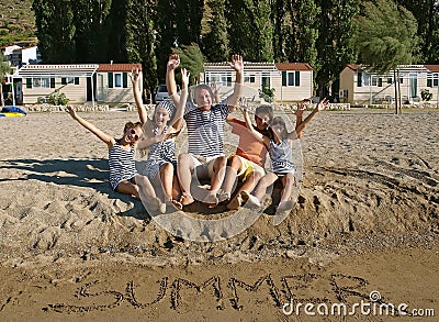 Family at sandy beach Stock Photo