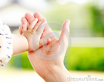 Family scene , closeup parent and baby holding hand Stock Photo