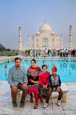 Family sitting on a bench at Taj Mahal complex in Agra, Uttar Pr Editorial Stock Photo