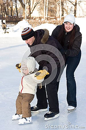 Family skating at the rink Stock Photo