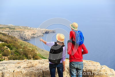 Family with small kid travel in scenic mountains Stock Photo