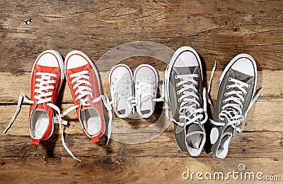 Family Sneakers canvas shoes parents and child on wood floor at home in happy lifestyle Stock Photo