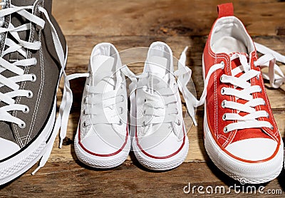 Family Sneakers canvas shoes parents and child on wood floor at home in happy lifestyle Stock Photo