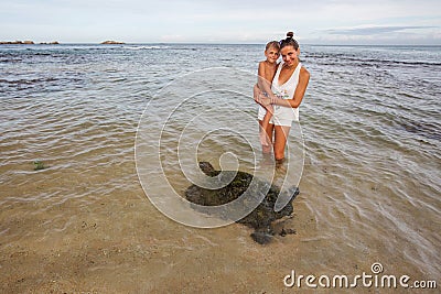 Family snorkeling with turtle at the tropical coast of Sri Lank Stock Photo