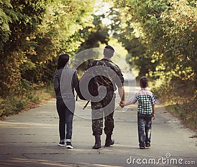 Family and soldier in a military uniform Stock Photo