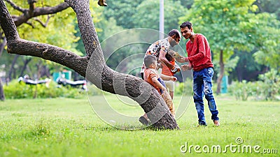 family spending time in the park together Editorial Stock Photo