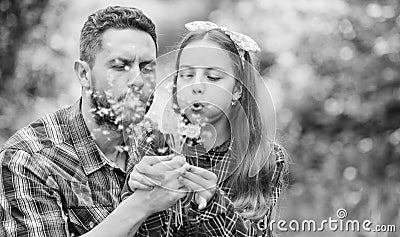 Family summer farm. daughter and father love dandelion flower. little girl and happy man dad. earth day. spring village Stock Photo
