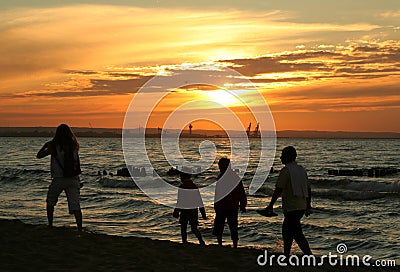 Family sunset stroll Stock Photo