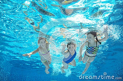 Family swim in pool or sea underwater, mother and children have fun in water Stock Photo