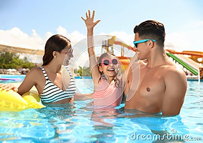 Family in swimming pool. Summer vacation Stock Photo