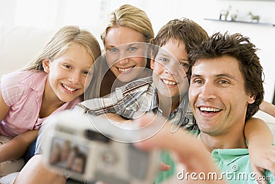 Family taking self portrait with digital camera Stock Photo