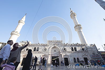 Family taking selfies in front of the Al-Husseini Mosque Amman Jordan Editorial Stock Photo