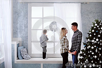 Family of father and mother meet new year at home Stock Photo