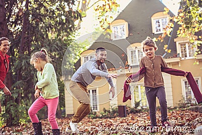 Family time. Parents have play with little girls outside. Stock Photo