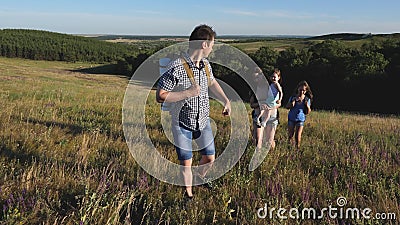 Family of tourists with children in the countryside. Travellers admire the beautiful scenery and nature. Teamwork of. Family of tourists with children in stock footage Family of tourists with children in the countryside. Travellers admire the beautiful scenery and nature. Teamwork of. Family of tourists with children in stock footage