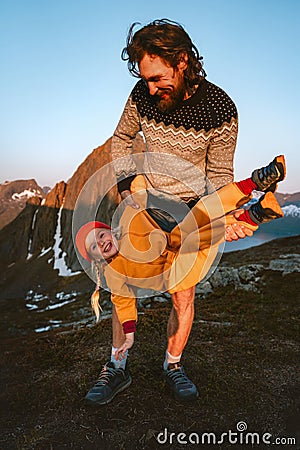 Family travel father having fun with daughter child outdoor hiking adventures in Norway healthy lifestyle Stock Photo