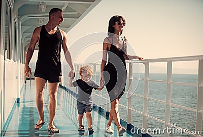 Family travelling on cruise ship on sunny day. Family with cute son on summer vacation. Family rest concept. Father Stock Photo