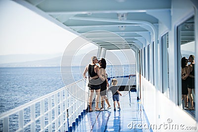 Family travelling on cruise ship on sunny day Family and love concept. Father, mother and child stand on deck of cruise Stock Photo