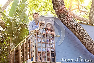 Family on the tree house Stock Photo