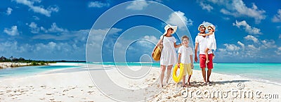 Family on a tropical beach vacation Stock Photo