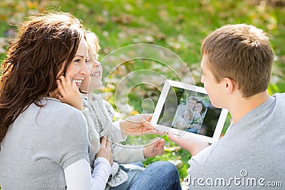 Family using tablet PC Stock Photo