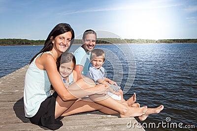 family on vacation have a lot of fun and love relax on wood pontoon Stock Photo