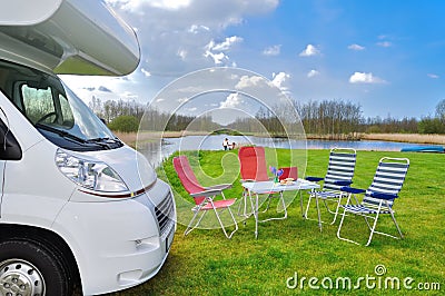 Family vacation, RV camper travel concept, motorhome trip, table and chairs in campsite Stock Photo