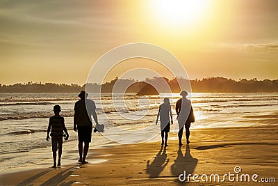 Family vacation in the tropics by the sea - silhouettes of people walking on the beach at sunset. Editorial Stock Photo