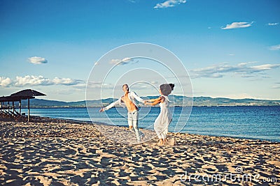 Family and valentines day. Summer holidays and travel vacation. Sexy woman and man at sea. Couple in love dance on beach Stock Photo