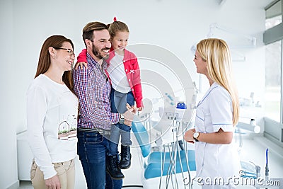 Family visits dentist in dental office Stock Photo