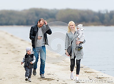 Family walk in city park. Stock Photo