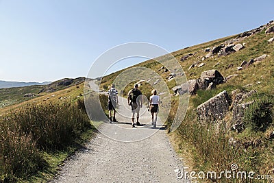 Family walking along the trail to Snowdon, Wales Editorial Stock Photo