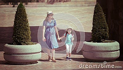 Family walking together in a sunny day of summer Editorial Stock Photo