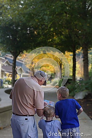 Family walks city suburb sidewalk Stock Photo