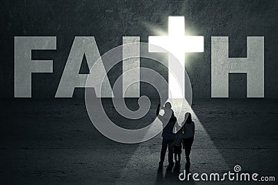 Family walks toward faith door Stock Photo