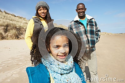Family Wallking On Winter Beach Stock Photo