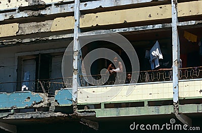 A family in a war damaged building in Angola. Editorial Stock Photo