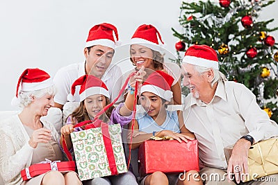 Family watching little girl Stock Photo