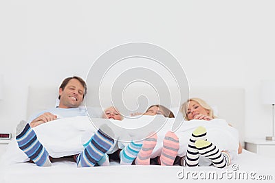 Family wearing stripey socks Stock Photo