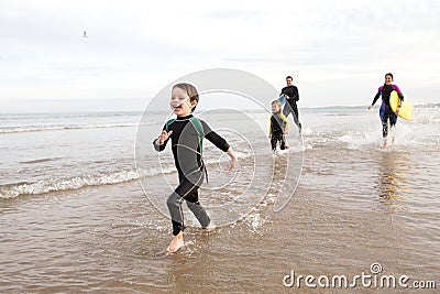 Family in Wetsuits Stock Photo