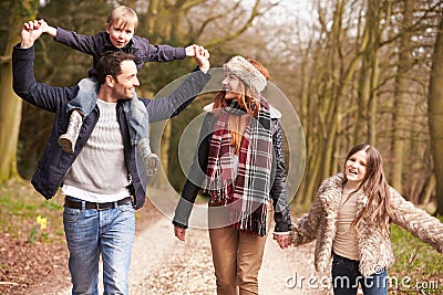 Family On Winter Countryside Walk Together Stock Photo