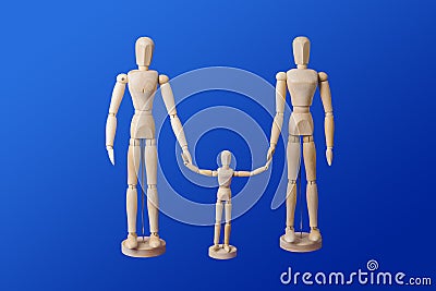 Family - wooden toy figures on blue Stock Photo