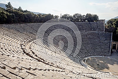 Famous ancient Epidauros amphitheater located in Greece near Lighourio city at early sunset in backlight Stock Photo