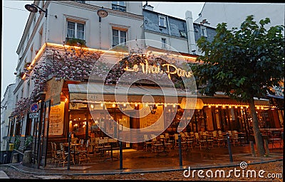 The famous Cafe Le Vrai Paris . It is located in the Montmartre, Paris, France. Editorial Stock Photo