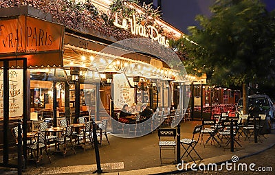 The famous Cafe Le Vrai Paris at night . It is located in the Montmartre, Paris, France. Editorial Stock Photo