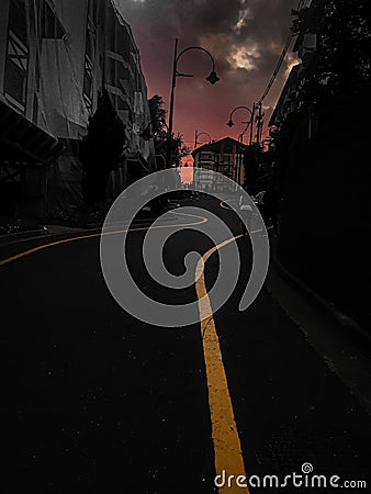 Famous crooked street on lawn in Rio Grande do Sul, late afternoon with low light and its markings on the road Editorial Stock Photo