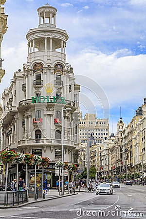 Famous Edificio Grassy building with the Rolex sign and beautiful buildings on Gran Via shopping street in Madrid, Spain Editorial Stock Photo