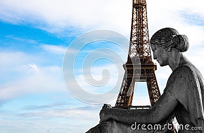 The Eiffel Tower in Paris in the arms of a statue of a seated woman Stock Photo