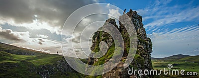 Lonely people, dog, grassland, mountain landscape on top overlook, Fairy Glen, Skye,Scotland, UK. Stock Photo